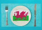 Dinner plate with Welsh flag, knife and fork either side 