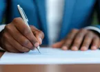 hands - person signing a business contract 