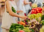 person using a cotton shopping bag for grocery shopping 