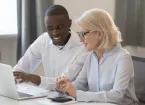 businessman and businesswoman accountants working together on pc