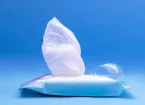A wet wipe peeps out of the pack.