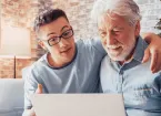 Younger generation caring about older relatives teaching using computer