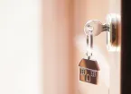 key in the door of a house